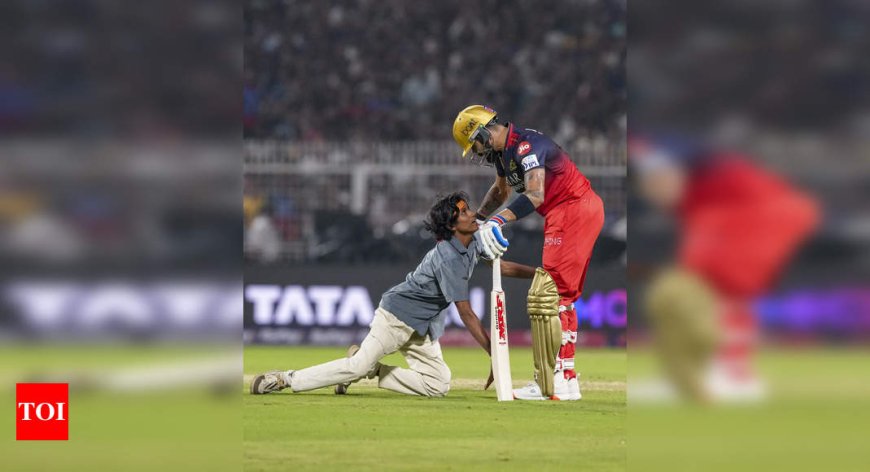 WATCH: Virat Kohli fan breaches security to touch RCB's star feet after fifty vs KKR